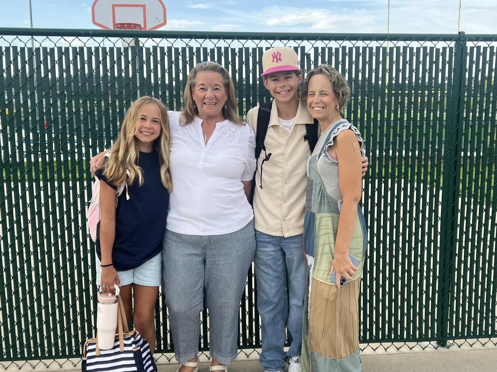 Irish with Ayden, Emmy Jo and family near a school field
